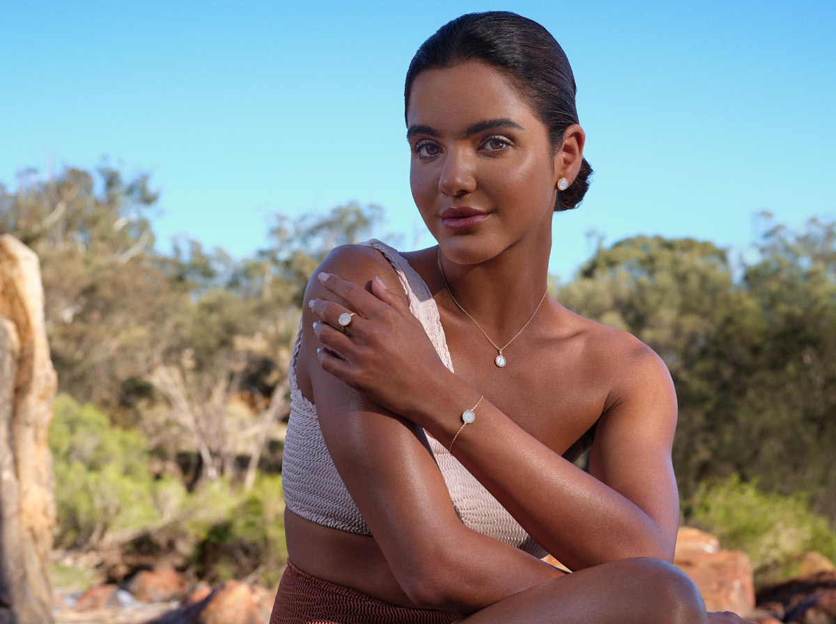 Beautiful model in Kailis jewellery, backdropped by Australian bush.